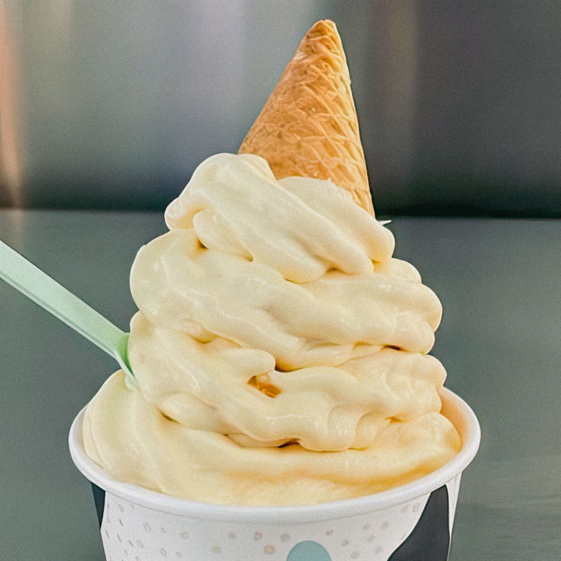 Ice cream in a cup with upside-down waffle cone and spoon sticking out - Real Aussie Fruit Icecream